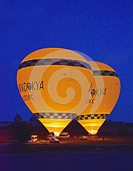 A pair of Hot Air balloons prepare to take off in the early morning air in Cappadocia Turkeye