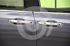 A pair of identical same similar luxury car door opening handles