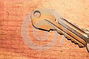 Pair of keys isolated on a wooden background. safety and security concept