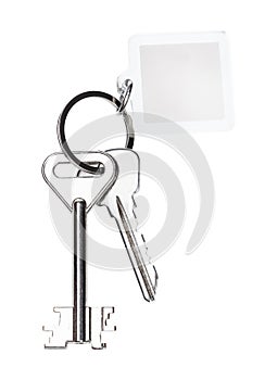 Pair of keys on ring with blank keychain isolated
