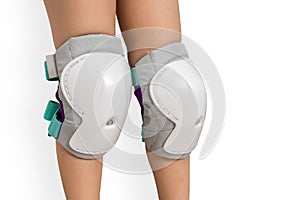 Pair of knee pads wearing on legs of child