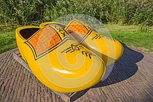 Pair of large yellow wooden shoes in Zaanse Schans