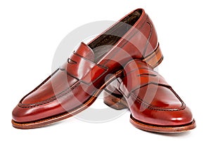 Pair of leather cherry calf penny loafer shoes together