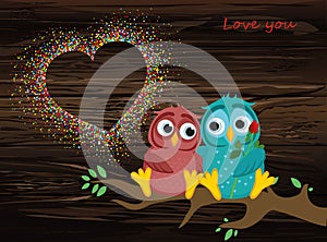 A pair of lovely owls in love, sit on a branch. Colorful confett