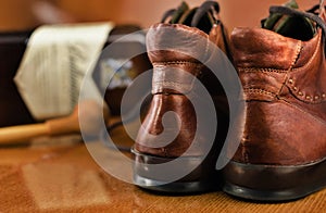 Pair of luxury shoes tabaco pipe and bottle of whiskey photo