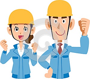 Pair of male and female working on construction site blue work clothes