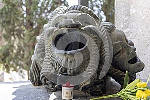 A pair of masks on the tomb of the Genoese actor of comedy Gilberto Govi, founder of the Genoese dialect theater in the monumental