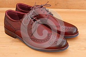 A pair of men`s dress shoes wingtip brogue leather oxford