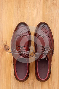 A pair of men`s dress shoes wingtip brogue leather oxford photo