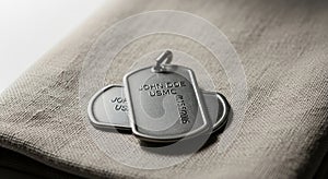 Pair of metallic dog tags with