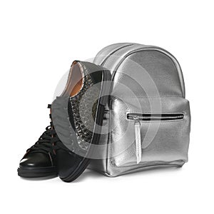 Pair of modern shoes and stylish backpack