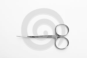 Pair of nail scissors on white