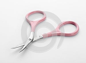 Pair of nail scissors on white