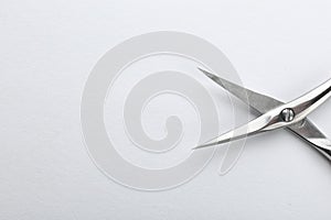 Pair of nail scissors on white background