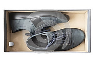 A pair of new blue man shoes in a shoe box isolated oh white