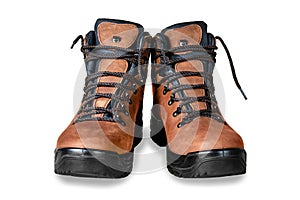 Pair of new modern high brown leather hiking boots isolated on white background. Two trekking rough warm winter footwear