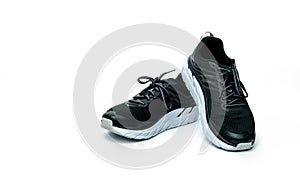 Pair of new running shoes  on white background. Black sneakers. Breathable fabric sport shoes with high abrasion rubber