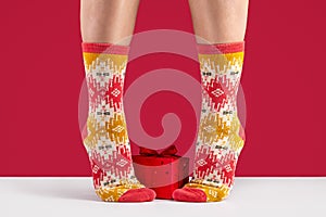 A pair of new, warm socks on women`s legs, close-up.