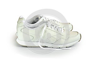A pair of new white leather sneakers on a white isolated background