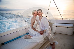 Young couple elope on boat photo