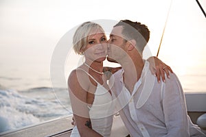 Young couple elope on boat photo