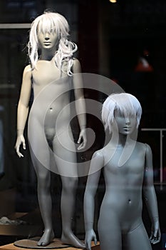 Pair of nude teenaged mannequins