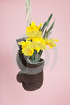 a pair of old boxing gloves hacked to become a vase