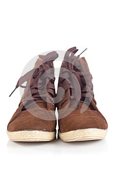 Pair of old Brown working boots with shadows