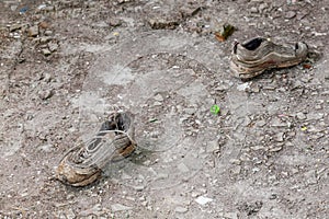 Pair of old dirty used shoes