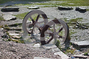 A pair of old disused metal mine train wheels