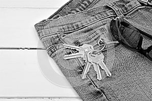 Pair of Old Jeans, Set of House Keys, and Sunglasses