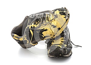 Pair of old paint covered training shoes photo