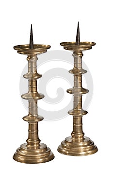 Pair old pricket candle stick holders isolated on white