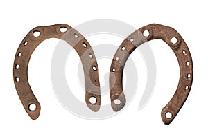 Pair of old rusty horseshoes isolated