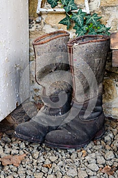 Pair of old vintage used winter high knee boots made of felt and leather