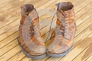 Pair of old worn brown leather hiking boots