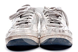 A pair of old worn sports shoes