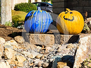 Pair of painted pumpkins greet passerbys