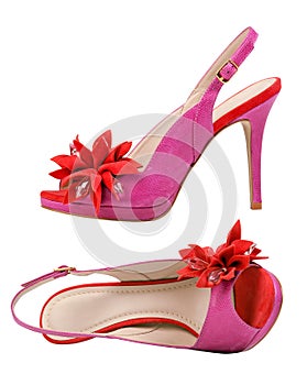 Pair of pink female open-toe shoes over white