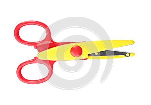 Pair of plastic scissors on white