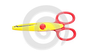Pair of plastic scissors on white