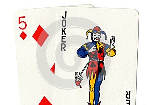 Pair of playing cards showing a joker and a five.