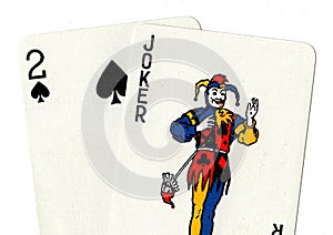 Pair of playing cards showing a joker and a two.