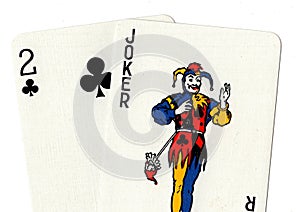 Pair of playing cards showing a joker and a two.