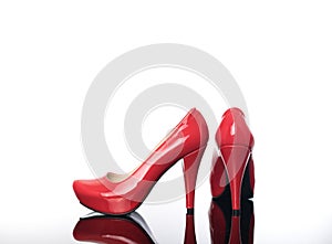 Pair of pointed female shoes in red high heels platform