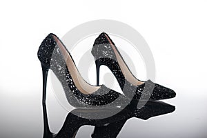 pair of pointed high heels shiny women`s shoes