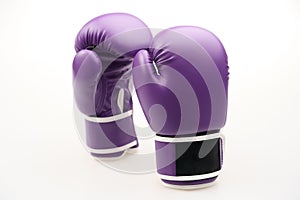 Pair of purple boxing gloves isolated on a white background