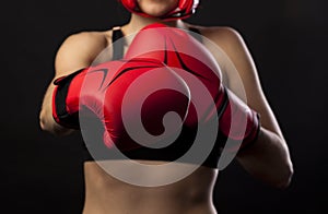 A pair of red boxing gloves, punching