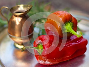 A pair of red capsicum annuum (bell peppers).