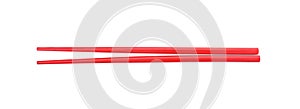 Pair of red chopsticks isolated on white, top view